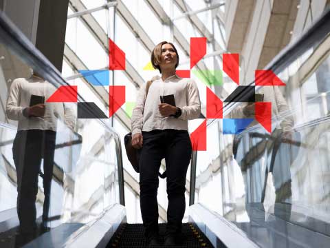 a person walking down the escalator