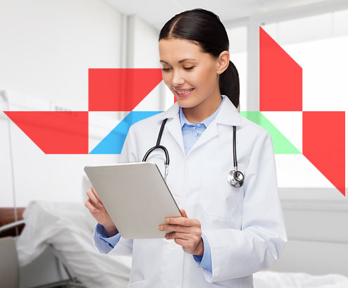 a medical professional on an ipad