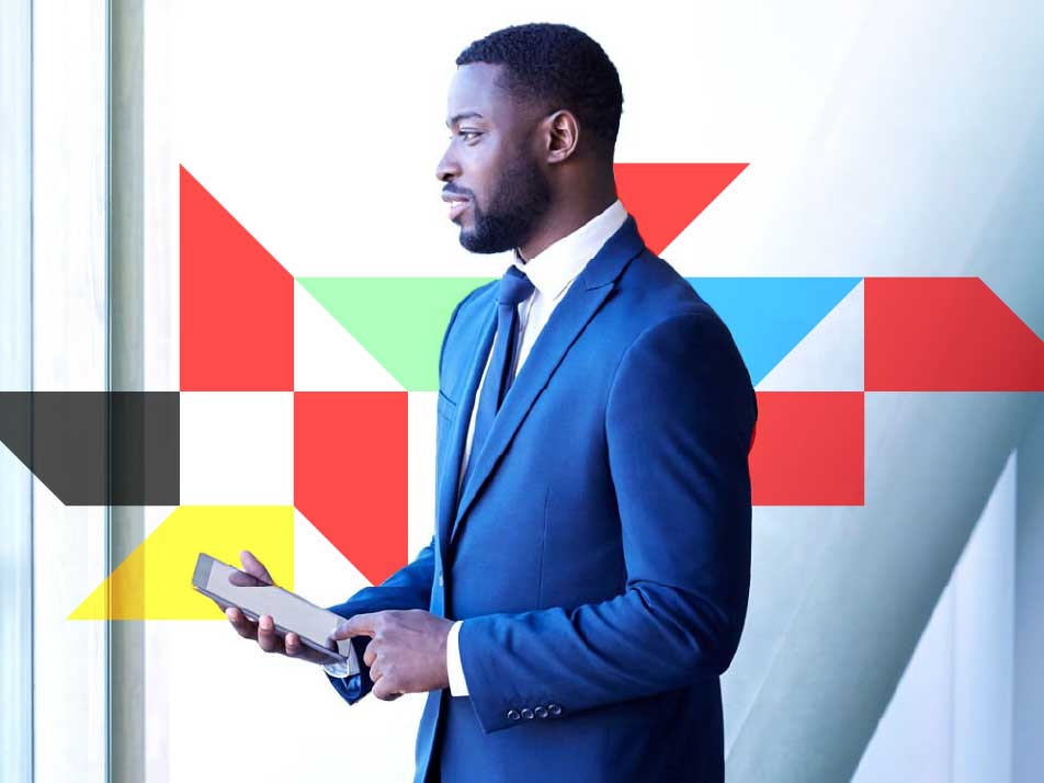 Man in a suit holding a tablet with trapezoids